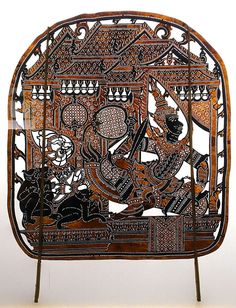 an intricately carved wooden chair with people on it