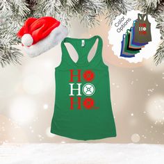 a green tank top with the word ho hoo on it next to a christmas tree