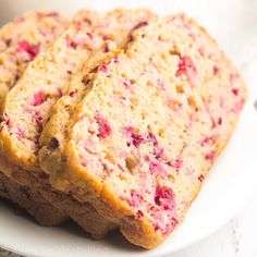 two slices of strawberry bread on a white plate