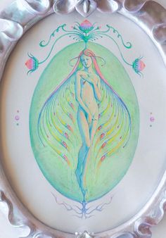 a plate with a drawing of a woman in the center and peacock feathers on it