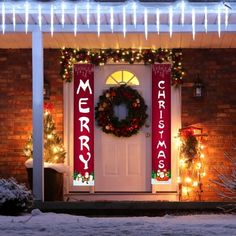 a front door decorated with christmas lights and wreaths