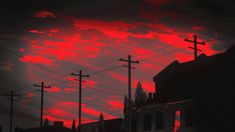 the sky is red and black with some power lines