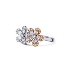 A special two-tone metal double flower ring featuring pear cut diamonds and round cut diamonds. At each flower center is a round diamond followed by pear cut diamond petals. Five petals on each side one set in white gold one set in rose gold, currently a finger size 6.5. Diamond Flower Ring, Double Finger Ring, Double Diamond, Pear Cut Diamond, Flower Center, Diamond Flower, Finger Ring, Ring Finger, Flower Ring