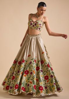 Elevate your ethnic wardrobe with Ivory Embroidered Lehenga. Crafted from luxurious silk, the lehenga features intricate thread, sequin, and cutdana embroidery in stunning floral patterns. Teamed with a modern cut embroidered strappy blouse and a beautifully adorned dupatta. This ensemble is ideal for a bride or bride-to-be, ensuring an unforgettable, elegant look for your special day. Composition : Skirt & Blouse - Silk, Dupatta - Net Care: Dry Clean Only and Vacuum Storage This product can be customized for sleeves, length and colour Delivery : 4-6 weeks as the product is hand crafted. Check Size Guide or choose MySize for free customisation (All Sizes above XL can be made at 15% additional cost) For more information and sizes please contact fabiliciousfashion@gmail.com or visit our Cope