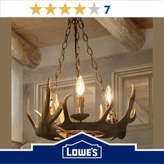 a chandelier with deer antlers hanging from it's sides and two lights on each side