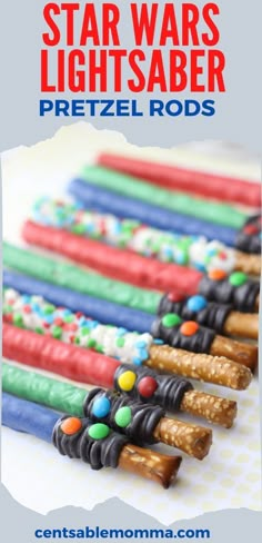 star wars light saber pretzel rods are lined up on a table with the words,