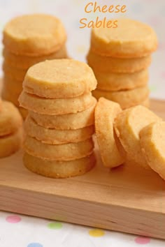 some cookies are stacked on top of each other with the words cheese sables above them