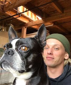 a man and his dog pose for the camera