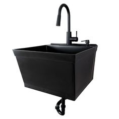 a black sink with a faucet on the side and an attached faucet