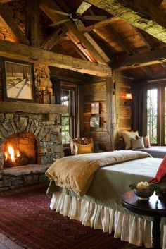 a bed room with two beds and a fire place