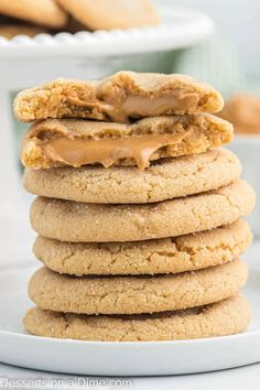 a stack of cookies with peanut butter on top