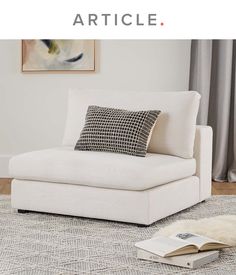 a white chair sitting on top of a rug