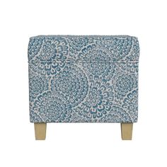 an upholstered blue and white patterned footstool with wooden legs on a white background