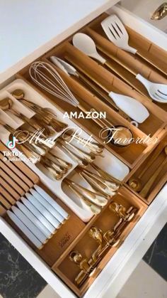 an open drawer with utensils and spoons in it that are labeled amazon