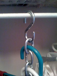 a pair of scissors hanging from a hook