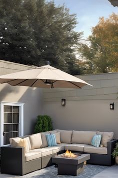 Outdoor patio with beige sectional sofa, fire pit, and large umbrella. Living Roofs, Built In Seating, Covered Pergola