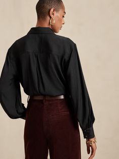 A customer favorite, this flowing twill utility shirt uses incredible drape, full volume sleeves, and utilitarian details to create the most versatile top for every occasion or adventure.  RELAXED FIT: Expertly cut for a loose fit.  SUSTAINABILITY: M Volume Sleeves, Full Volume, Utility Shirt, Black Shirt, Banana Republic, Sustainability, Loose Fitting, Balloons, Long Sleeve Blouse