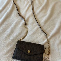 Brand New With Tag Included Used Once. Wallet/Crossbody/Iphone Case, Brown Monogram Michael Kors Wallet With Mobile Phone Bag, Crossbody Wallet On Chain With Branded Hardware, Brown Crossbody Wallet On Chain With Removable Pouch, Brown Crossbody Wallet On Chain For Travel, Brown Crossbody Wallet On Chain, Michael Kors Mercer, Mk Purse, Pink Crossbody Bag, Bags Michael Kors