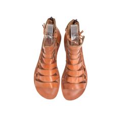 COLOR: Tan LEATHER TYPE: Vegetable Leather MATERIAL: Made from %100 leather. SOLE: Leathery IN SOLE : %100 leather. HEEL HEIGHT: 1.5 cm DESIGN: Lace-up & Zippered GENDER: Women's The FIBO Hera Tan Leather Sandal is expertly crafted with %100 leather, a zipper back closure, and an ergonomic heel design for comfort. These shoes are handcrafted and expertly stitched by skilled artisans for a unique pair of sandals. Tan Leather Sandals, Flat Gladiator Sandals, Insole Design, Vegetable Leather, Heel Design, Leather Sandals Women, Womens Sandals Flat, Designer Heels, Women Lace