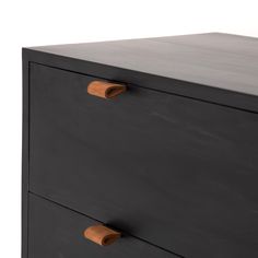 a black dresser with two drawers and brown handles