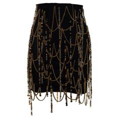 ▪ Dolce & Gabbana black corseted mini skirt ▪ Gold metal chain detail ▪ Beaded tassels ▪ Metal hook closures at centre-back ▪ IT 42 - FR 38 - UK 10 - US 6 ▪ Spring-Summer 1991 Gold Inspired Outfits, Black And Gold Clothes, Black And Gold Outfit Parties, Dolce And Gabbana Aesthetic, Dolce And Gabbana Skirt, Skirt With Chains, 1stdibs Fashion, Black And Gold Skirt, Gold Clothes