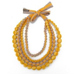 MARIMEKKO Statement Necklace, Fabric Bead Necklace in fabric bag, Finnish design 48 cm 19 in. Gorgeous fabric bead statement necklace by Finnish designer brand Marimekko. Striped cotton jersey fabric in orange, red, yellow and gray.  Length of the necklace is 90 cm ( 35.5"), Diameter of each bead is approx. 2 cm (1¾ inches) Good vintage condition. Marimekko Jewelry - Marimekko Design Whether topping off your Marimekko ensemble, or adding a pop of Finnish charm to an otherwise Marimekko-less outf Necklace Orange, Folk Design, Beaded Statement Necklace, Orange Fabric, Fabric Beads, Marimekko, Gorgeous Fabrics, Fabric Bag, Yellow Orange