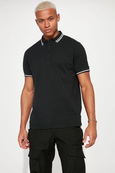 Model Height: 6'2 - Wearing Large Big & Tall: Height 6'5 - Wearing XXL Available In Black, White, Grey, Pink, Red, Navy, Neon Pink, Neon Yellow, Green, Yellow, Light Blue, and Coral Fold Down Collar 3 Button Closure Short Sleeve 100% Cotton Imported | Mens Wilson Short Sleeve Polo in Black size 2XL by Fashion Nova Casual Black Polo Collar Top, Casual Black Shirt With Collared Neckline, Casual Black Collared Shirt, Black Relaxed Fit Polo Shirt, Relaxed Fit Black Polo Shirt, Black Relaxed Fit Casual Polo Shirt, Casual Black Relaxed Fit Polo Shirt, Black Tops With Relaxed Fit And Collared Neckline, Black Cotton Top With Ribbed Collar