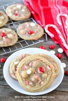 peppermint white chocolate chip cookies on a plate with candy canes in the background