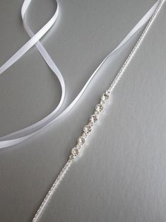 Bridal belt sash Super skinny bridal belt Dainty crystal | Etsy Elegant Adjustable Belt With Rhinestones, Adjustable Bridal Belt With Sashes For Bridesmaid, Adjustable Bridesmaid Bridal Belt With Sashes, Formal Adjustable Bridal Belt With Rhinestones, Formal Adjustable Rhinestone Bridal Belt, Thrift Manifest, Dress Belts, Crystal Hair Vine, Bridal Sash Belt