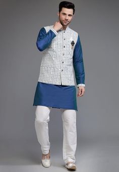 Cotton Silk Kurta in BlueThis Chinese Collar Neck and Full Sleeve Readymade attire is Enhanced with Buttons and Digital PrintAvailable with a Cotton Silk Pant in White and a Cotton Silk Nehru Jacket in Off WhiteDo note: Brooch and Footwear shown in the image is for presentation purposes only. Half to one inch may vary in measurement. (Slight variation in actual color vs. image is possible)  We sell all kinds of menswear. Mens Kurta | Mens Kurta Pajama | Mens Sherwani | Mens Sherwani Sets | Tradi Blue Cotton Nehru Jacket With Long Sleeves, Fitted Blue Nehru Jacket For Spring, Blue Cotton Nehru Jacket For Festive Occasions, Festive Blue Cotton Nehru Jacket, Mens Kurta Pajama, Indian Jackets, Silk Kurta Set, Vs Image, Mens Sherwani