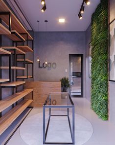 a living room filled with lots of wooden shelves and plants on the wall next to a glass table