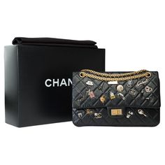 Amazing​ ​and​ ​Rare​ ​Chanel​ ​2.55​ ​limited​ ​edition​ ​2.55​ ​Metiers​ ​d'art​ ​2017​ ​"Lucky​ ​Charms"​ ​double​ ​flap​ ​shoulder​ ​bag​ ​in​ ​black​ ​quilted​ ​aged​ ​leather​ ​adorned​ ​with​ ​metal​ ​charms,​ ​rhinestones​ ​and​ ​enamel,​ ​antique​ ​gold​ ​metal​ ​trim,​ ​handle​ ​in​ ​aged​ ​gold​ ​metal​ ​allowing​ ​a​ ​hand​ ​or​ ​shoulder​ ​or​ ​crossbody​ ​carry 1​ ​patch​ ​pocket​ ​on​ ​the​ ​back​ ​of​ ​the​ ​bag Double​ ​flap Padded​ ​flap​ ​closure,​ ​​ ​​ ​2.55​ ​closure​ ​in​ ​aged​ ​gold​ ​metal Inner​ ​lining​ ​in​ ​burgundy​ ​leather,​ ​​ ​​ ​a​ ​double​ ​patch​ ​pocket,​ ​​ ​​ ​1​ ​passing​ ​lipstick Signature:​ ​"ChanelMade​ ​in​ ​France" Date:​ ​2017 Dimensions:​ ​24x15x7​ ​cm​ ​(9,5x5,9x2,7​ ​Inches) Chain​ ​length:​ ​50​ ​cm​ ​(19.7​ ​Inches) Reference:​ ​101417 Black Tears, Flap Shoulder Bag, Metal Charms, Luxury Purses, Chanel 2, Lucky Charms, Metal Trim, Black Quilt, Metal Charm