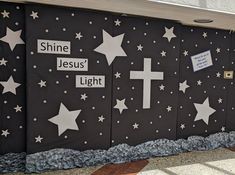 a wall with stars painted on it and the words shine jesus'light written on it