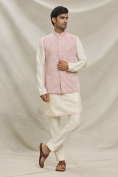 Lavender bundi with floral embroidery. Paired with an inner cream kurta and pant. - Aza Fashions Pink Chanderi Sherwani For Wedding, Transitional Off-white Sets With Floral Embroidery, Cream Sets With Floral Embroidery For Transitional Season, Transitional Floral Embroidered Cream Sets, Transitional Cream Sets With Floral Embroidery, Elegant Spring Nehru Jacket In Straight Kurta Style, Spring Wedding Cotton Silk Kurta, Elegant Nehru Jacket For Spring, Elegant Spring Nehru Jacket