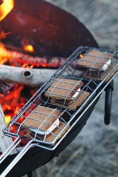 some food is cooking over an open fire