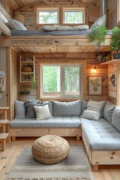 a living room filled with lots of furniture and wooden walls in the middle of it