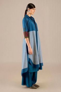 Blue chanderi high-low cape in woven stripe base. Comes with inner tunic and palazzo. - Aza Fashions Blue Silk Outerwear For Fall, Blue Long Sleeve Kurta For Fall, Elegant Blue Kurta For Workwear, Elegant Blue Kurta For Work, Blue Silk Outerwear For Work, Blue Long Sleeve Kurta For Workwear, Blue Long Sleeve Workwear Kurta, Cape Shirt, Palazzo Set