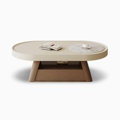 an oval coffee table with two clocks on it