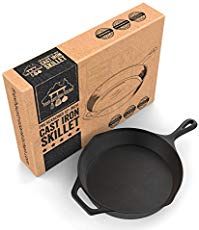 an empty cast iron skillet next to a cardboard box