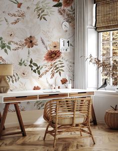 an office with floral wallpaper and wicker desk in front of a window,