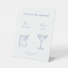 a sign that has some drinks on it with the words signature drinks written in blue ink