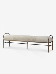 a metal bench with a cushion on it