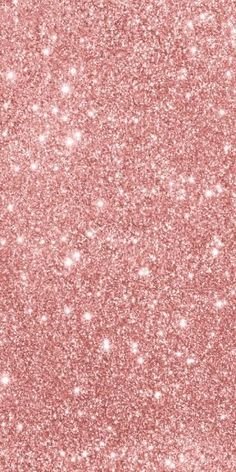 a pink glitter background with small white dots