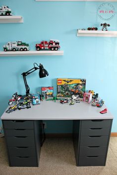 a desk with legos and toys on it