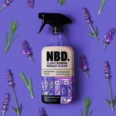 a bottle of n b d plant - based really clean on a purple background surrounded by lavender flowers