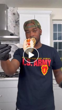 a man is eating food in the kitchen