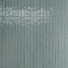 an image of a tiled wall that looks like it is going to be painted green