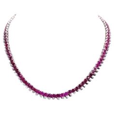 A sophisticated necklace of rubies and diamonds, carefully handcrafted to create a stunning embellishment . The careful attention to detail and precision , create a great experience of purchase . Magnificent necklace come in 18k gold with 109 pieces of Natural Burmese Rubies of 33,60 carats, in perfect cut, extra fine quality, and 109 pieces of Natural Diamonds of 4,50 carats, F color VS clarity, very sparkly and transparent. Handcrafted by artisan goldsmith. Excellent manufacture and quality of Burmese Ruby, 18k Gold Necklace, Ruby Diamond, Burmese, Natural Diamonds, Diamond Necklace, Embellishments, Ruby, 18k Gold