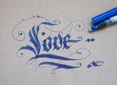 a pen and some ink on a piece of paper with the word hope written in it