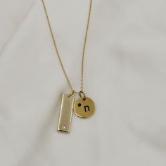 Give the gift of customization this holiday season with our gold filled tag necklace. Keep it simple with one tag or create a stacked looked and add multiple tags with different customizations to create a unique and timeless piece. Names, dates, etc. make the most thoughtful gift! These pieces are engraved in house and made to order! Include your customization in the note section on the cart page! Standard chain length is 17" with 2" of extender chain for adjusted length. Looking for a longer le Minimalist Yellow Gold Hand Stamped Charm Necklace, Minimalist Personalized Necklace For Everyday, Everyday Personalized Minimalist Custom Necklace, Everyday Minimalist Personalized Necklace, Gold Nameplate Charm Necklace For Mom, Gold Initial Necklace Hand Stamped For Gift, Gold Hand Stamped Initial Necklace Gift, Gold Hand Stamped Initial Necklace For Gift, Gold Minimalist Initial Necklace Customizable